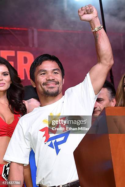 Welterweight champion Manny Pacquiao gestures during a fan rally at the Mandalay Bay Convention Center on April 28, 2015 in Las Vegas, Nevada....