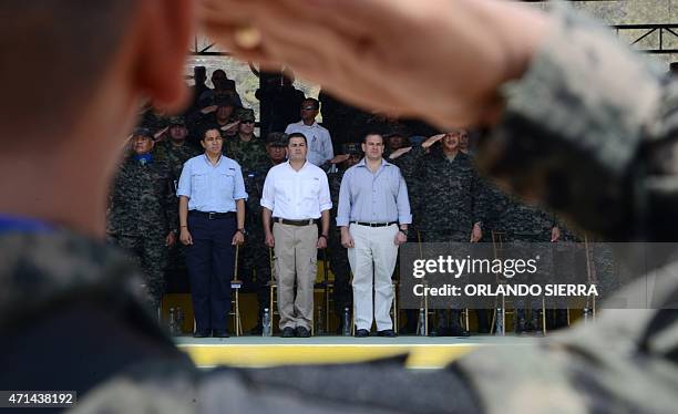 Honduran President Juan Orlando Hernandez attends the graduation ceremony of 513 Military Police new members in Tegucigalpa, on April 28, 2015....