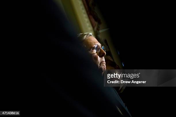 Senate Majority Leader Mitch McConnell listens to questions from reporters during a news conference after a policy meeting with Senate Republicans,...
