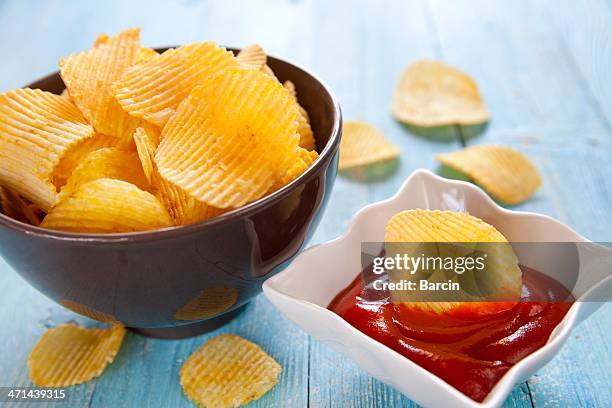 potato chips with ketchup - scalloped stock pictures, royalty-free photos & images