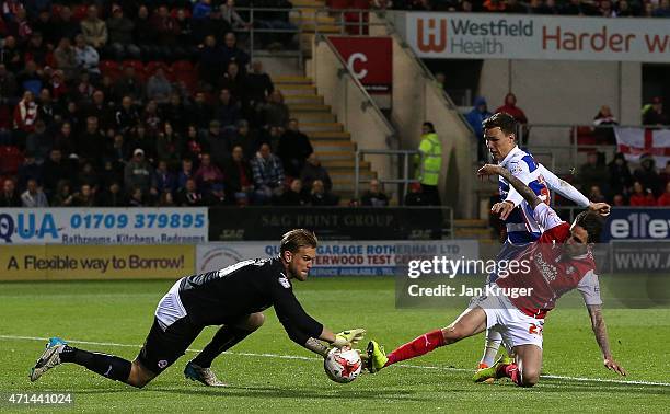 Matt Derbyshire of Rotherham scores the opening goal past Mikkel Andersen, Goalkeeper of Reading during the Sky Bet Championship match between...