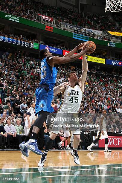 Jack Cooley of the Utah Jazz grabs a rebound against Bernard James of the Dallas Mavericks on April 13, 2015 at EnergySolutions Arena in Salt Lake...