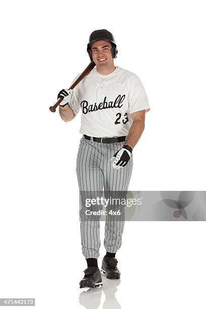 happy baseball player walking - batting isolated stock pictures, royalty-free photos & images