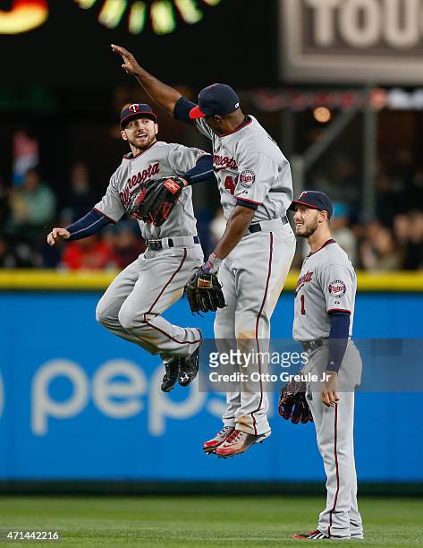 Outfielders Shane Robinson, Torii Hunter, and Jordan Schafer of the Minnesota Twins celebrate after defeating the Seattle Mariners at Safeco Field on...