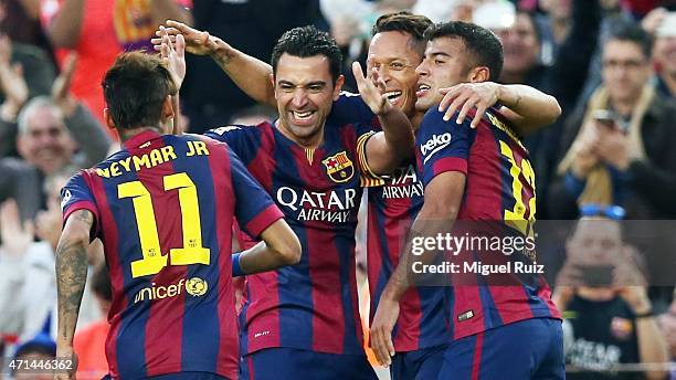 Xavi Hernandez of FC Barcelona celebrates with his team-mates Neymar, Adriano and Rafinha as he scored the fourth goal during the La Liga match...