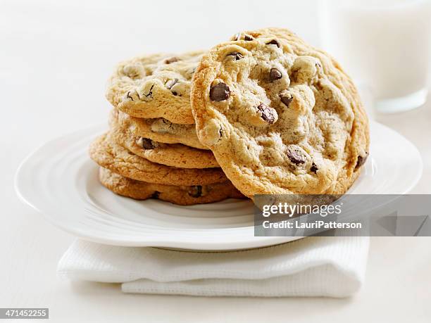 chocolate chip cookies and milk - chocolate chip cookie stock pictures, royalty-free photos & images