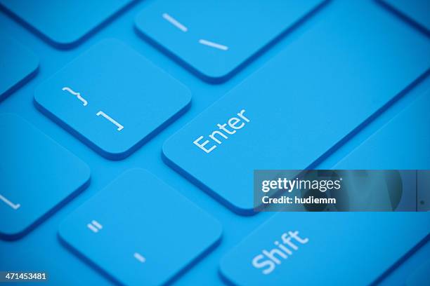 blue keyboard close-up - enter key stock pictures, royalty-free photos & images