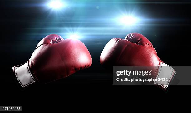 boxing gloves and flashes - slaan met vuist stockfoto's en -beelden