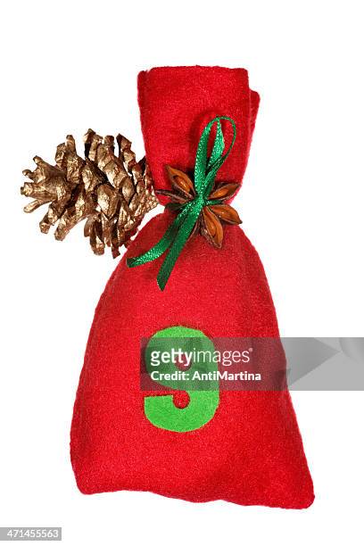 red christmas bag for advent calendar isolated on white - adventkalender stock pictures, royalty-free photos & images