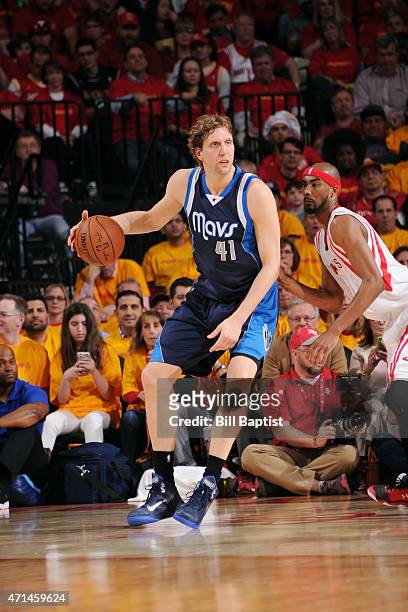 Dirk Nowitzki of the Dallas Mavericks handles the ball against the Houston Rockets in Game Five of the Western Conference Quarterfinals during the...