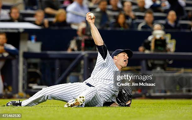 Chase Whitley of the New York Yankees fields the ball and holds his throw on a bunt single by Asdrubal Cabrera of the Tampa Bay Rays in the fifth...