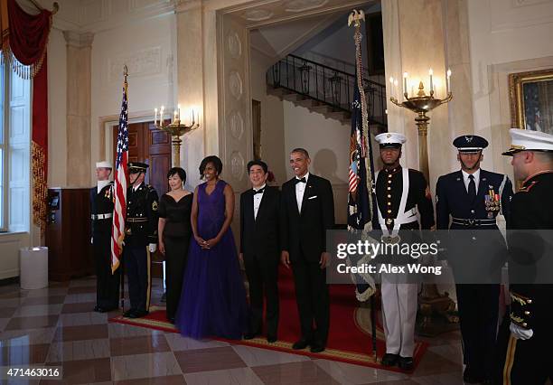 President Barack Obama , first lady Michelle Obama , Japanese Prime Minister Shinzo Abe and his wife Akie Abe participate in a group photo prior to a...