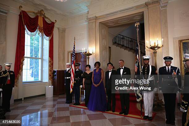 President Barack Obama , first lady Michelle Obama , Japanese Prime Minister Shinzo Abe and his wife Akie Abe participate in a group photo prior to a...