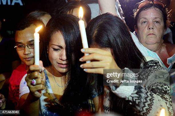 Group of Christians pray and hold a candlelight vigil to protest against the death penalty at Nusakambangan port, ahead of scheduled executions of...