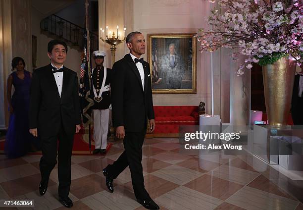 President Barack Obama , first lady Michelle Obama , and Japanese Prime Minister Shinzo Abe prior to a state dinner at the White House April 28, 2015...