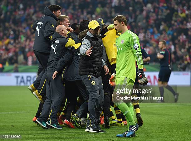 Head coach Juergen Klopp of Dortmund shakes hands with goalkeeper Manuel Neuer of Muenchen after the DFB Cup Semi Final match between FC Bayern...