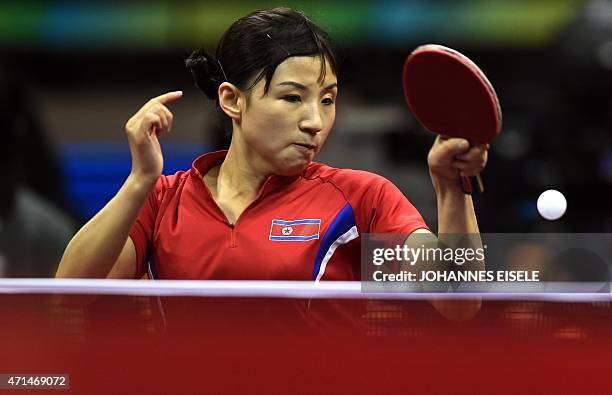 Kim Jong of North Korea hits a return during her women's singles match against Hirano Miu of Japan at the 2015 World Table Tennis Championships in...