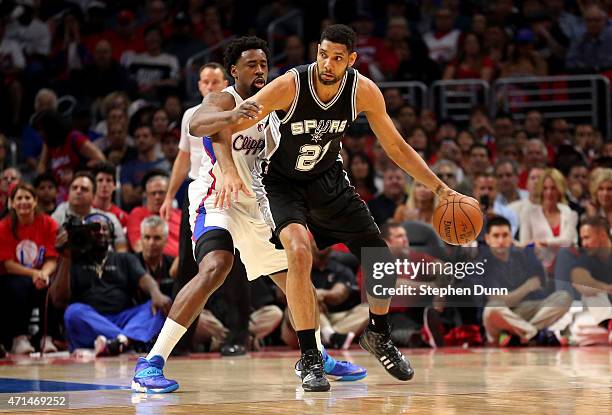 Tim Duncan of the San Antonio Spurs controls the ball against DeAndre Jordan of the Los Angeles Clippers during Game Five of the Western Conference...