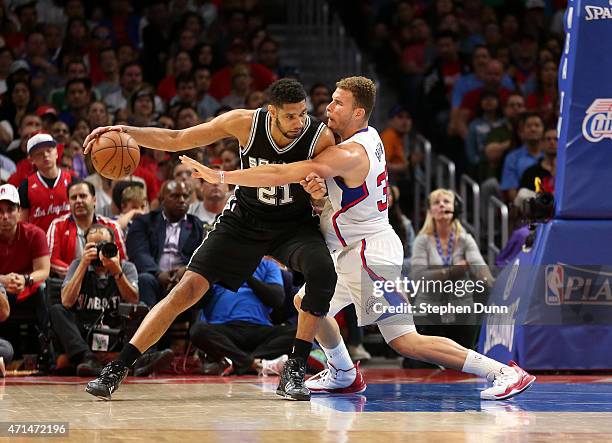 Tim Duncan of the San Antonio Spurs controls the ball against Blake Griffin of the Los Angeles Clippers during Game Five of the Western Conference...