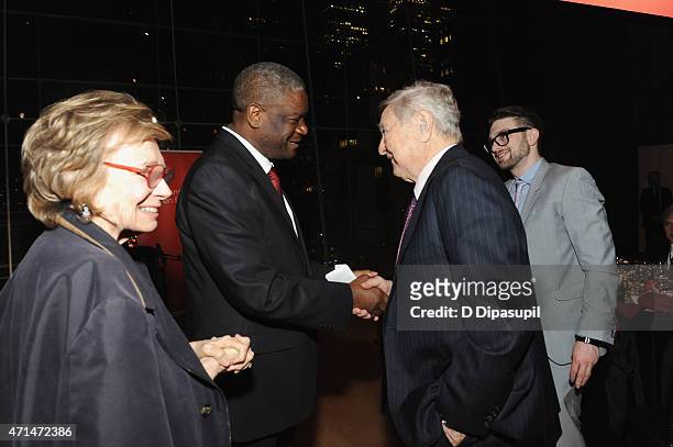Founder of Panzi Hospital, Dr. Denis Mukwege and George Soros greet each other as Alexander Soros looks on at the 2015 Physicians For Human Rights...