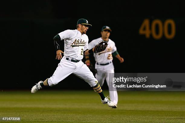 Eric Stogard of the Oakland Athletics catches a fly ball hit by C.J. Cron of the Los Angeles Angels of Anaheim in the seventh inning at O.co Coliseum...