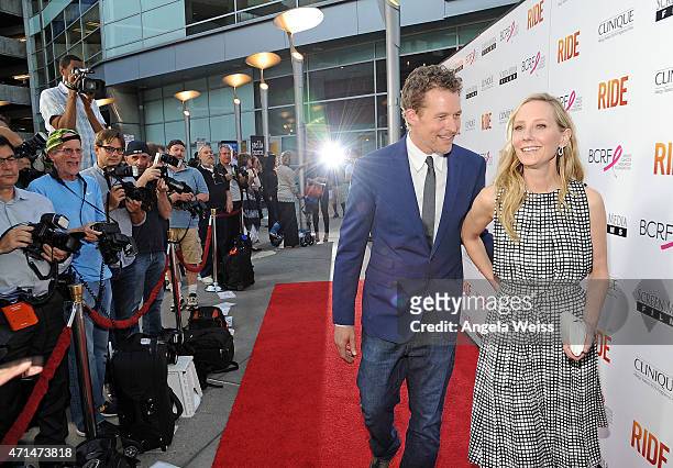 James Tupper and actress Anne Heche arrive at the premiere of "Ride" at ArcLight Hollywood on April 28, 2015 in Hollywood, California.