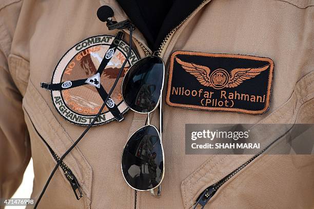 In a picture taken on April 26 Afghanistan's first female pilot Niloofar Rahmani poses for a photograph at an Air Force airfield in Kabul. With a...