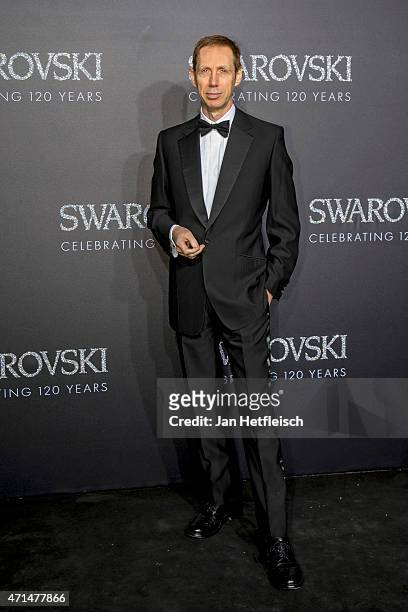 Photographer Nick Knight poses for a picture on the 'black' carpet of the grand re-opening of the Swarovski Crystal Worlds on April 28, 2015 in...