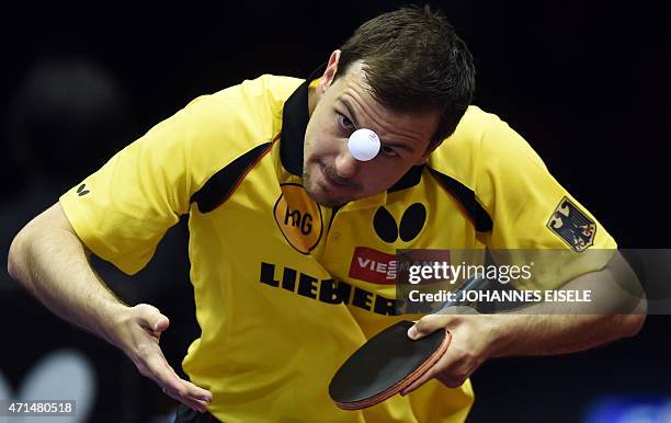 Timo Boll of Germany serves during his men's singles match against Jakub Dyjas of Poland at the 2015 World Table Tennis Championships in Suzhou on...