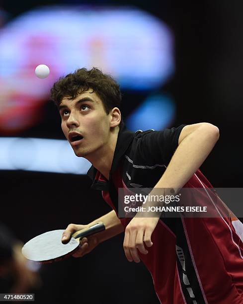 Jakub Dyjas of Poland serves during his men's singles match against Timo Boll of Germany at the 2015 World Table Tennis Championships in Suzhou on...
