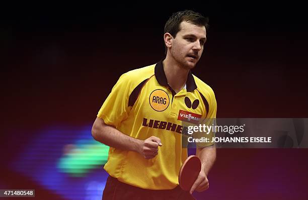 Timo Boll of Germany reacts during his men's singles match against Jakub Dyjas of Poland at the 2015 World Table Tennis Championships in Suzhou on...