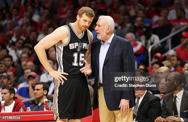 Head coach Gregg Popovich and Matt Bonner of the San Antonio Spurs confer as they play the Los Angeles Clippers during Game Five of the Western...