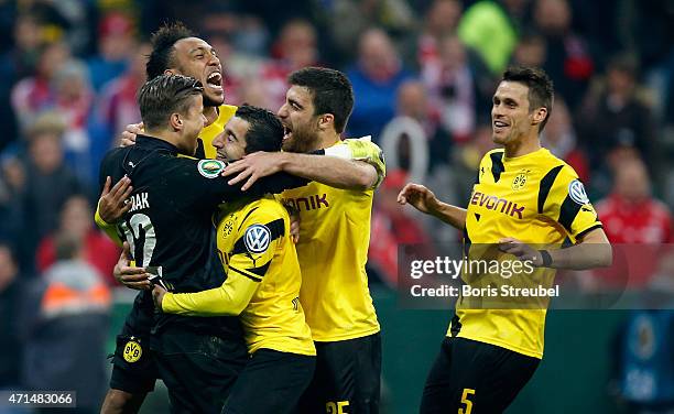 The team of Dortmund celebrate victory with their goalkeeper Mitchell Langerak after the DFB Cup semi final match between FC Bayern Muenchen and...