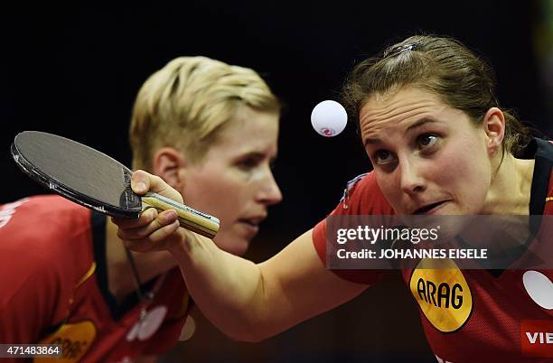 Kristin Silbereisen and Sabine Winter of Germany serve during their women's double match against Ai Fukuhara and Misako Wakamiya of Japan at the 2015...