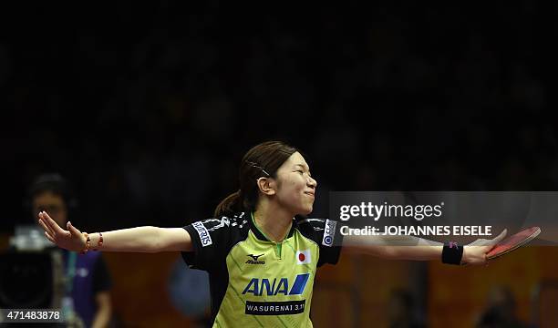 Ai Fukuhara of Japan reacts during her women's double match with Misako Wakamiya of Japan against Kristin Silbereisen and Sabine Winter of Germany at...