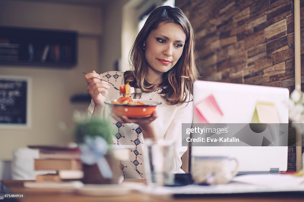 Young woman having lunch break