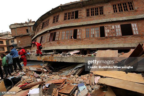 Rescue team from Taiwan continue the search operation in the debris of building at Hari on the outskirts of the capital city of Kathmandu on April...