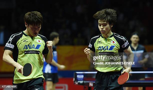 Morizono Masataka and Oshima Yuya of Japan react during their men's double match against Jakub Dyjas and Daniel Gorak of Poland at the 2015 World...