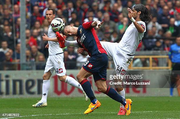 Juraj Kucka of Genoa CFC competes for the ball with Emmanuel Cascione of AC Cesena during the Serie A match between Genoa CFC and AC Cesena at Stadio...