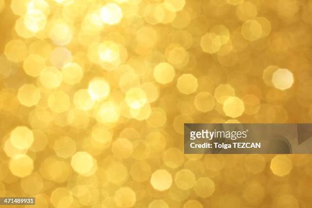 gold unscharf gestellt lichter - christmas texture stock-fotos und bilder