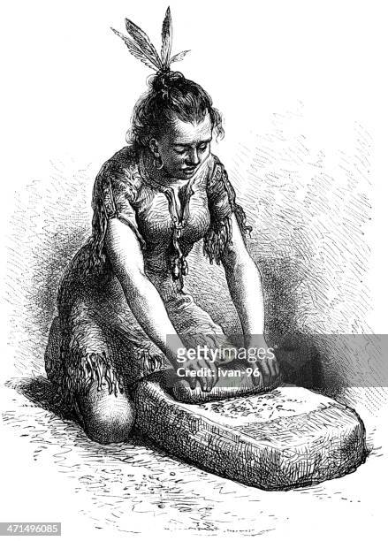 indian woman grinds corn on stone - grind stock illustrations