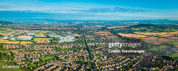 panoramic aerial photo over suburban homes surrounded by green countryside - gloucester england stock pictures, royalty-free photos & images