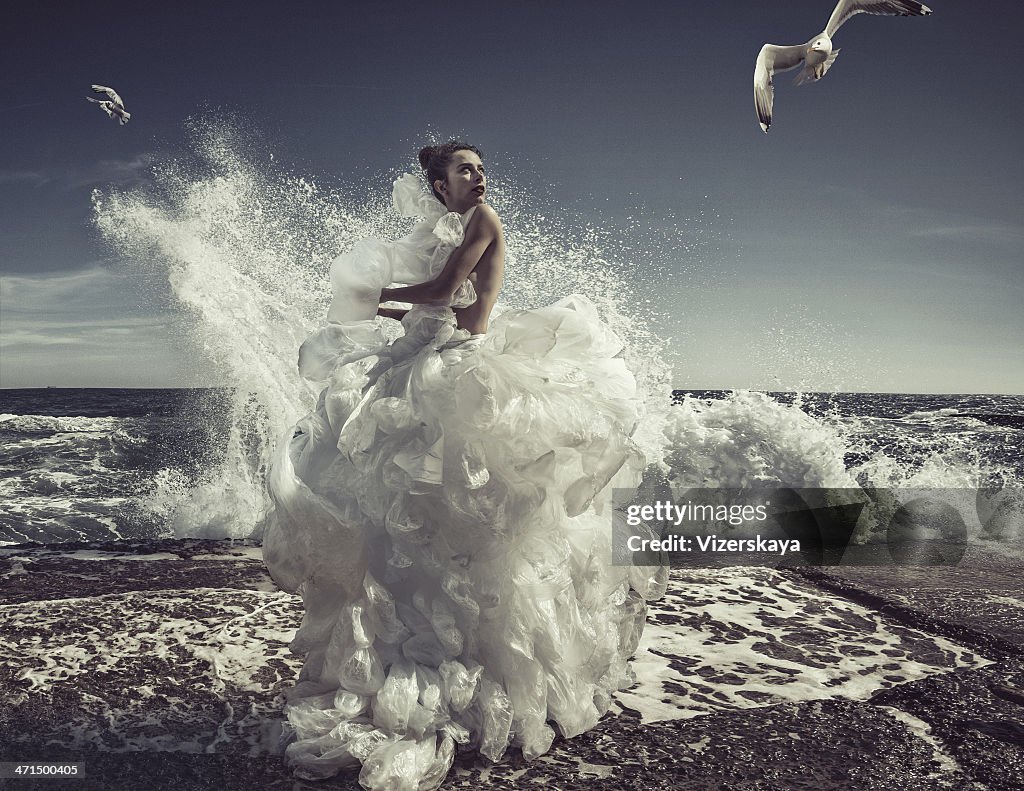 Women in plastic bag dress