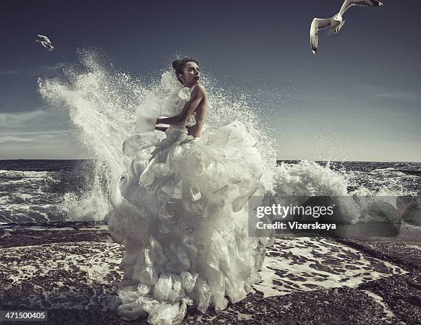 women in plastic bag dress - white dress stock pictures, royalty-free photos & images