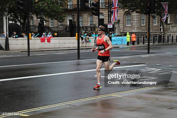 runner at the 2012 london 10k marathon - london marathon runners stock pictures, royalty-free photos & images