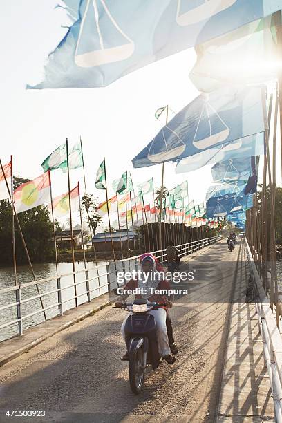 bridge that gives acces to kampung desar sabak. - election 2013 stock pictures, royalty-free photos & images