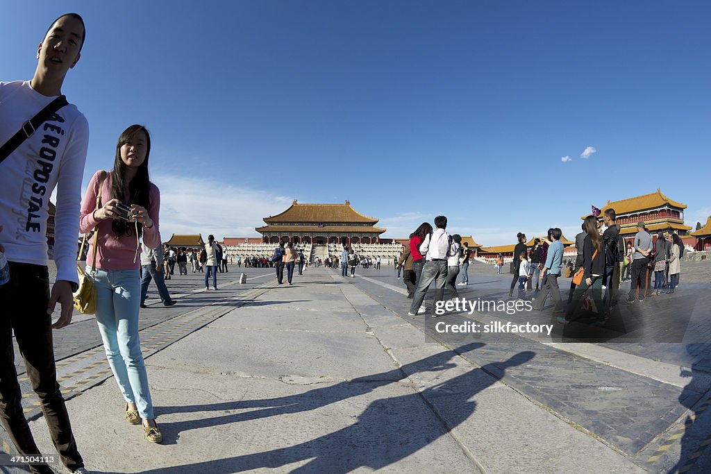 Chinese couple approaching photographer in the Forbidden City