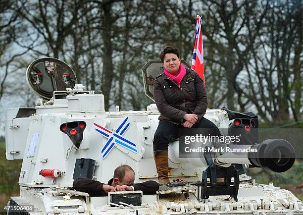 The Scottish Conservative Leader Ruth Davidson gets behind the wheel of a Tank at Auchterhouse Country Sports, as she highlights how the country's...