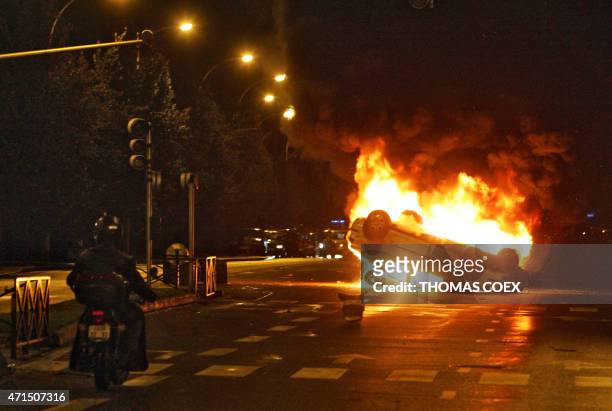 Car burns, 02 November 2005 in the northern Paris suburb of Aulnay-sous-Bois, after sixth straight night of unrest following the death by...