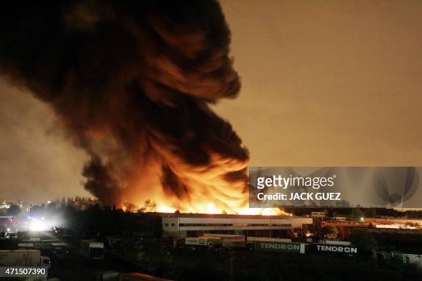 Picture shows a warehouse bruning in the early hours of 04 November 2005 in Aulnay-sous-Bois on the seventh consecutive night of violence on the...